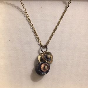 Mixed metal pendant necklace
